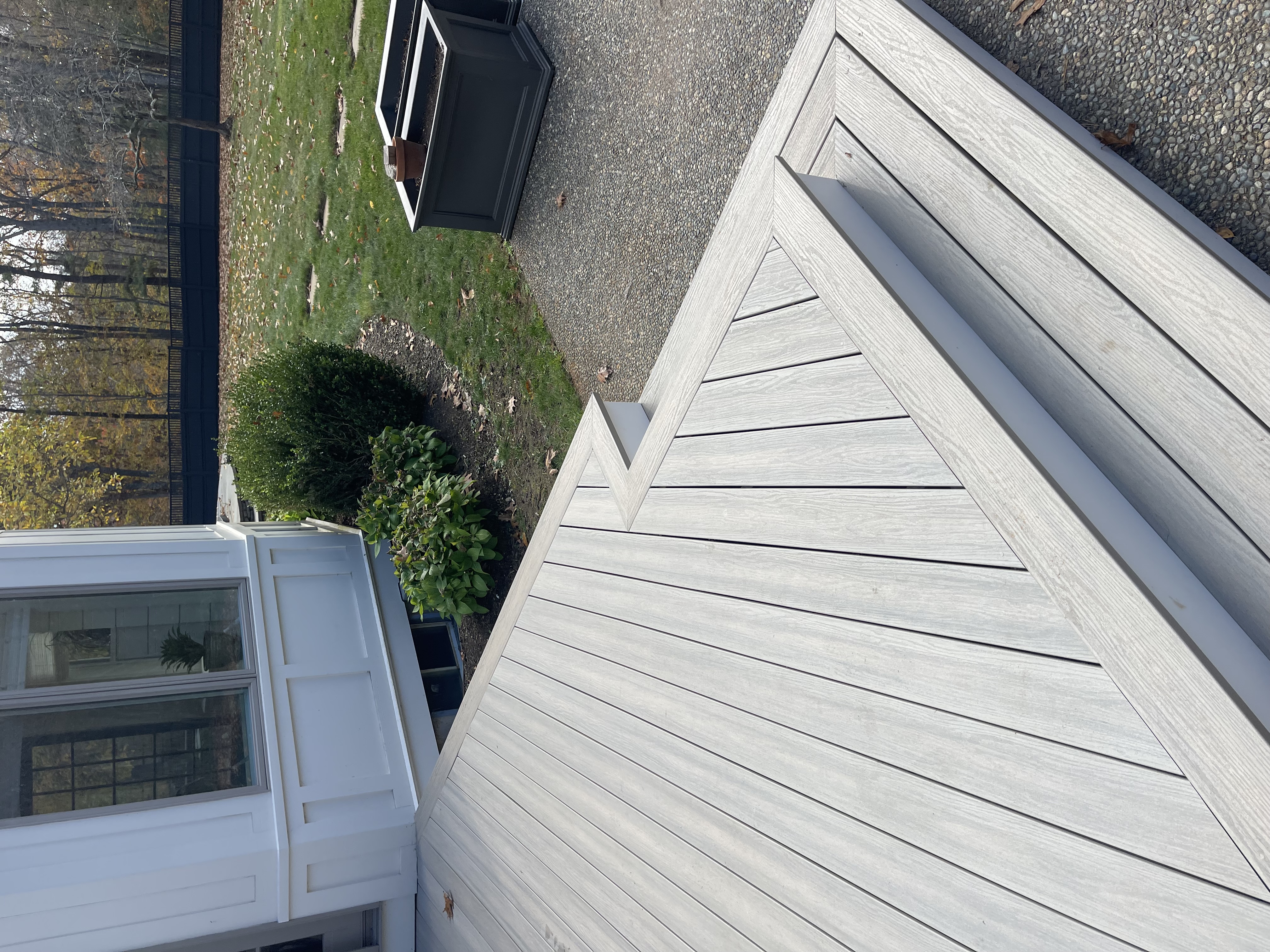 Composite deck installation with modern grey boards